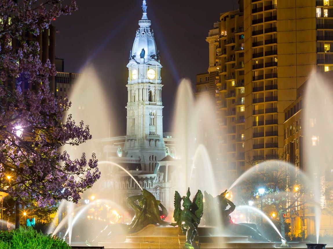 Swann Memorial Fountain at night, with City Hall in the background