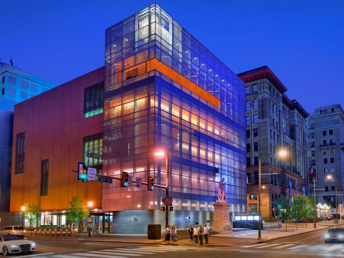 the lighted Weitzman National Museum of American Jewish History against a dusky blue sky