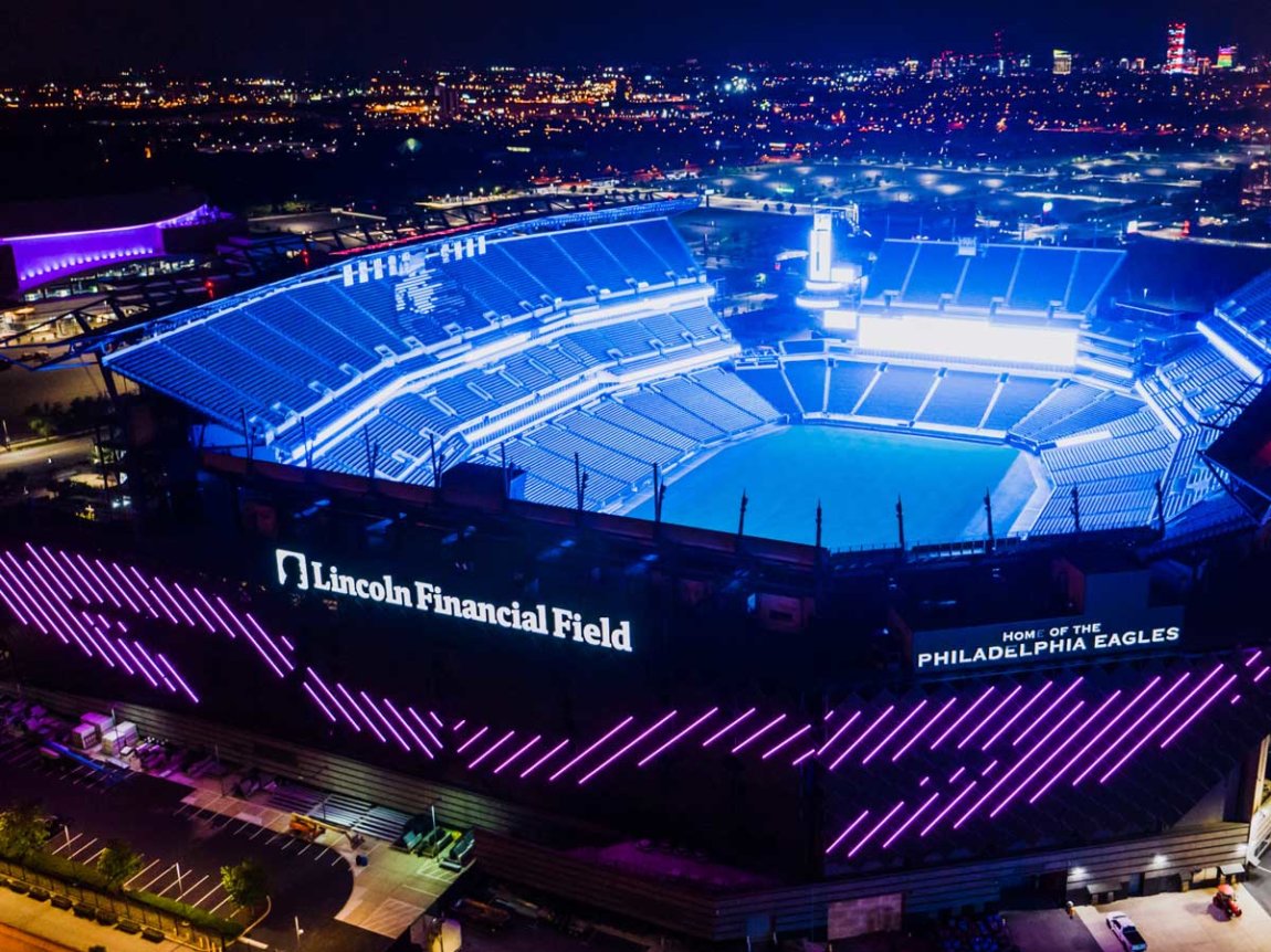 an arial exterior view of Lincoln Financial Field at night